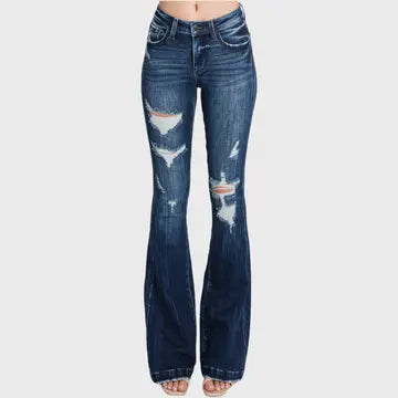 A pair of women's Petra Flare Jeans with a mid-rise waist, distressed detailing, and a button-zip closure.