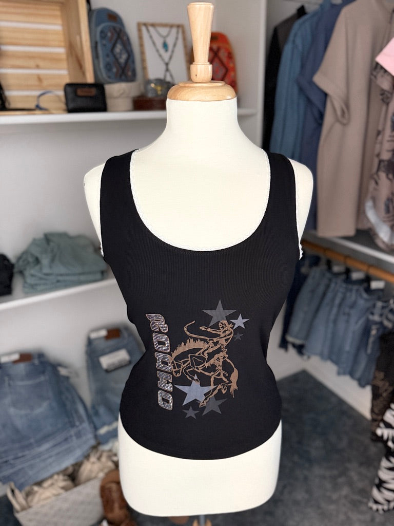 Black tank top with graphic design on a mannequin in a store.