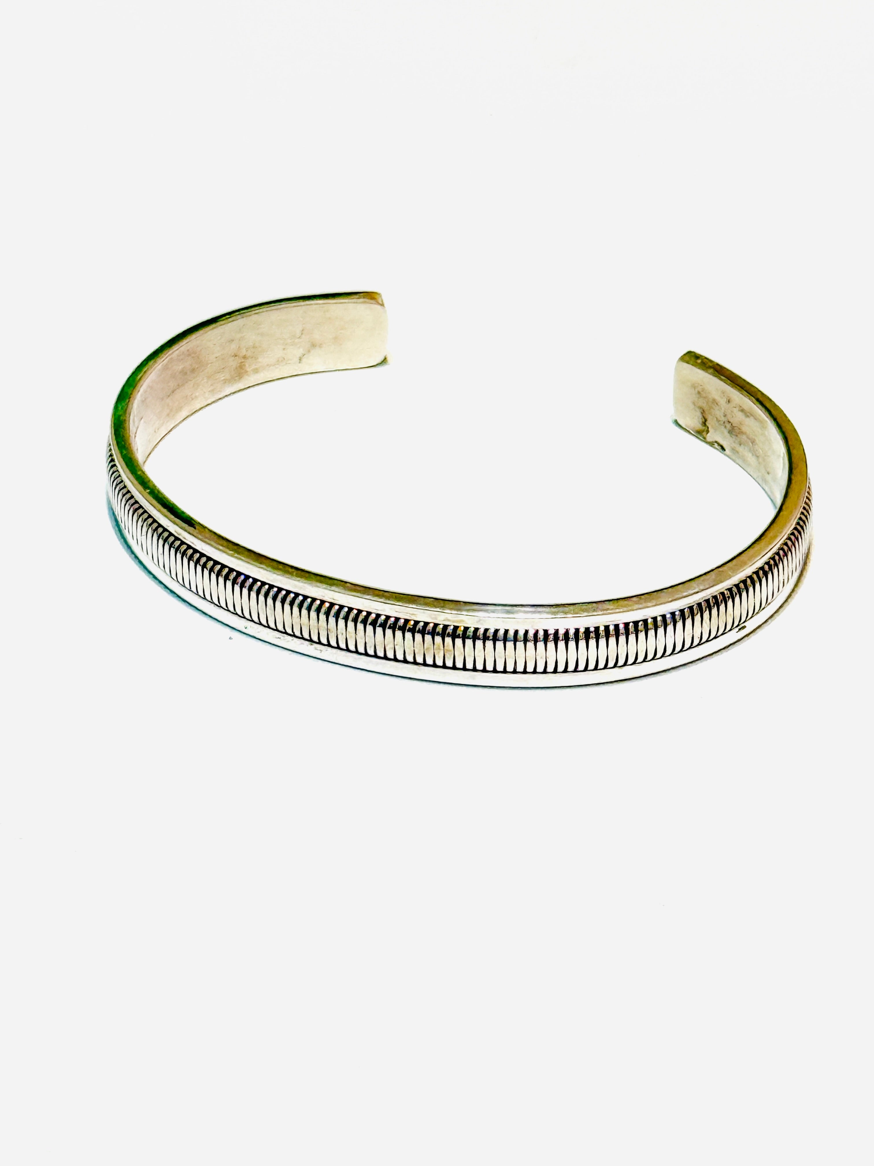 Silver bracelet on a white background