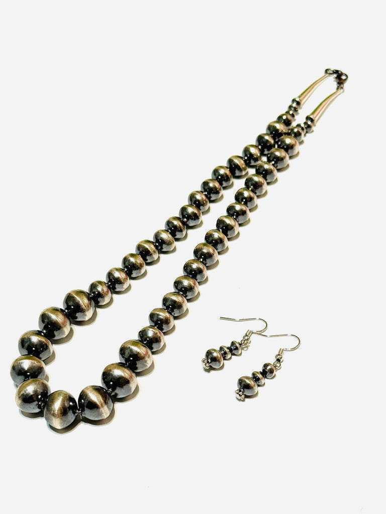 Necklace and matching earrings on a white background