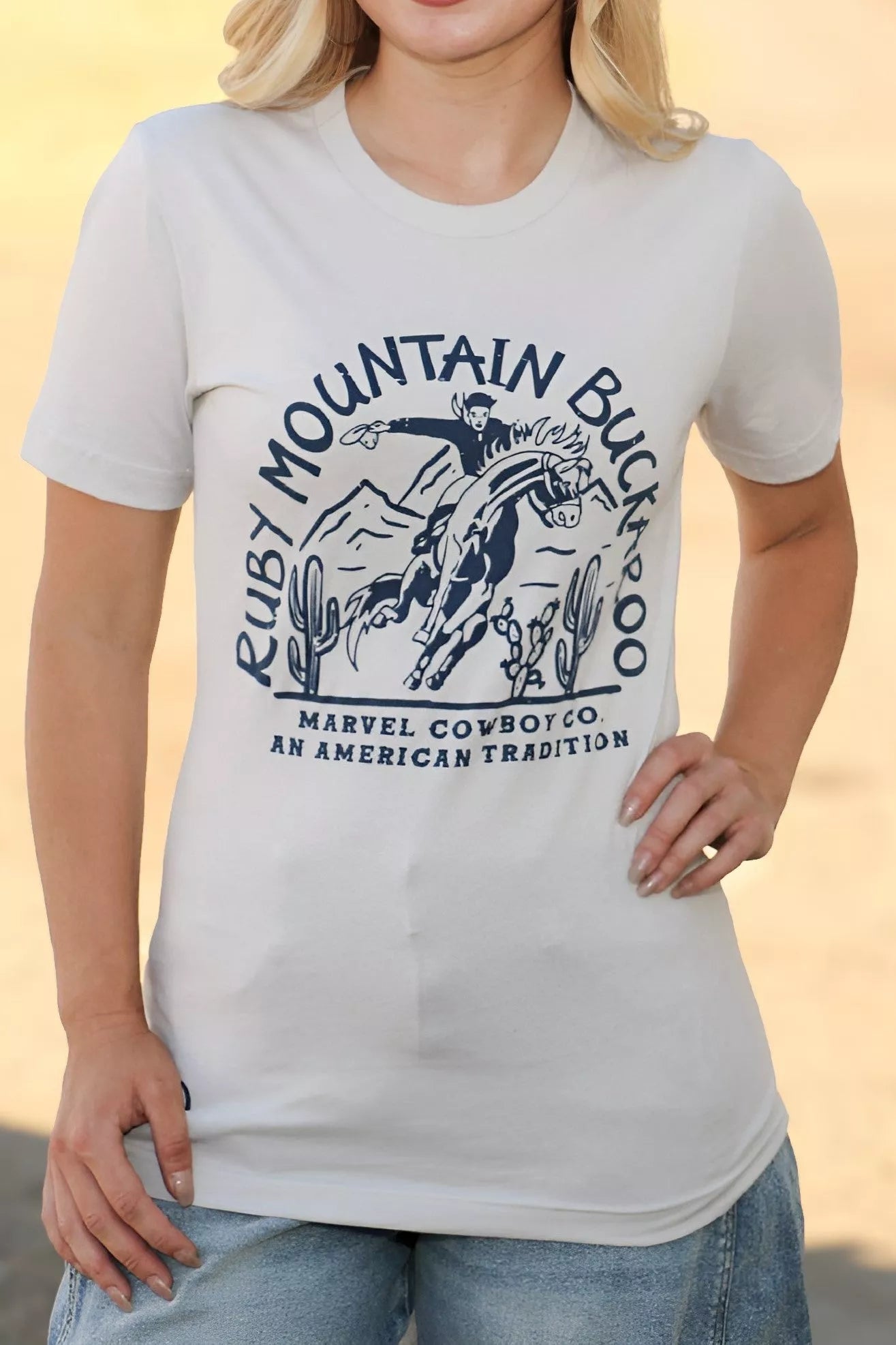 Person wearing a white t-shirt with a graphic design and text.