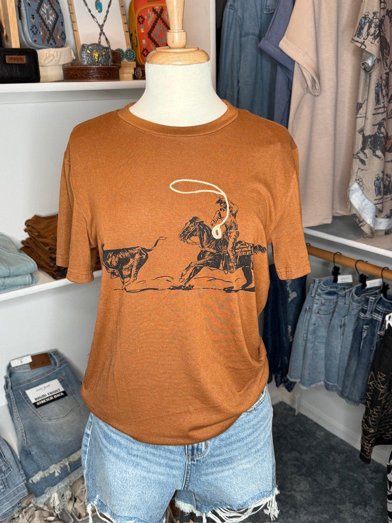 Brown t-shirt with cowboy graphic on mannequin in clothing store