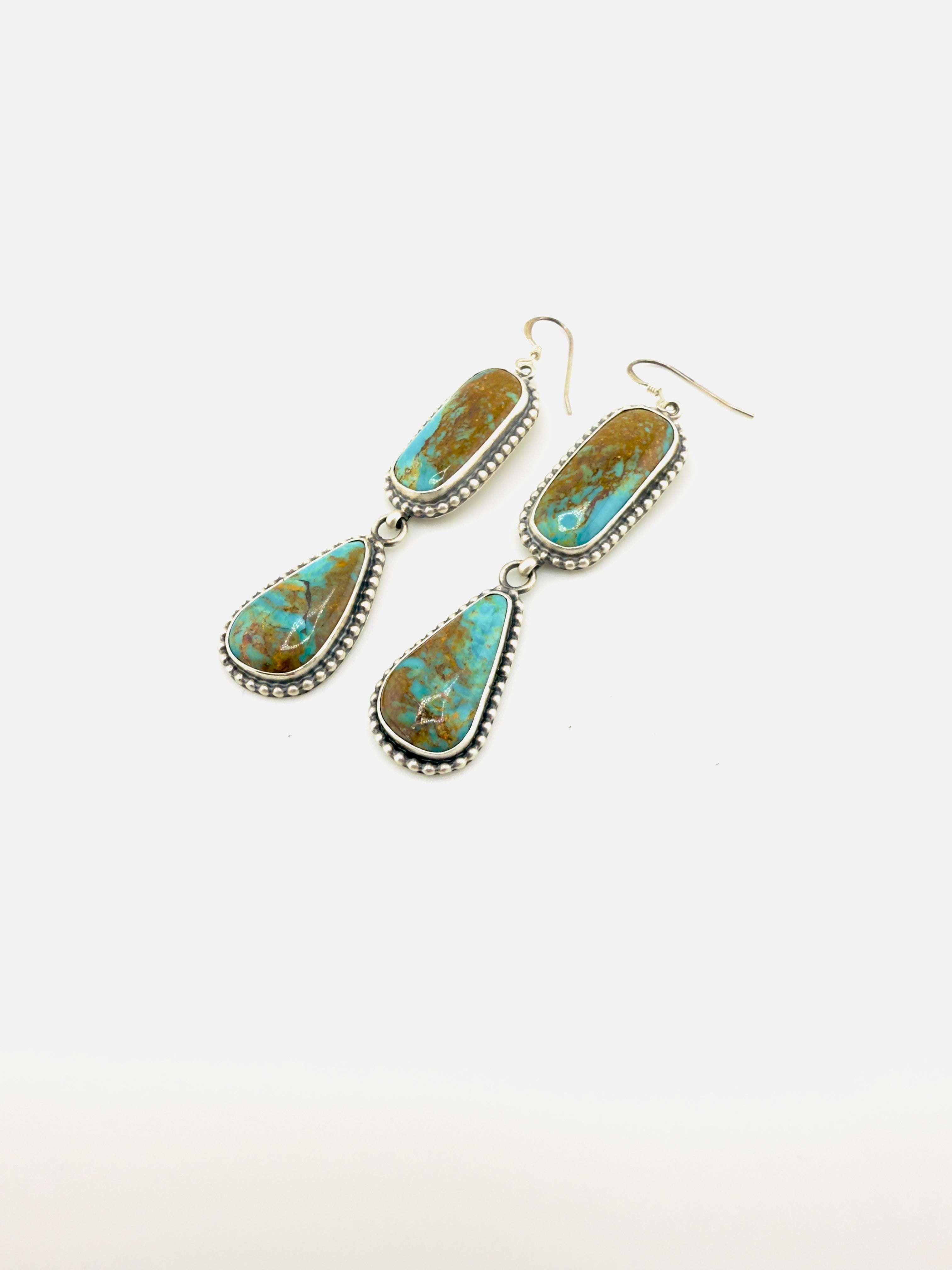 Turquoise earrings on a white background
