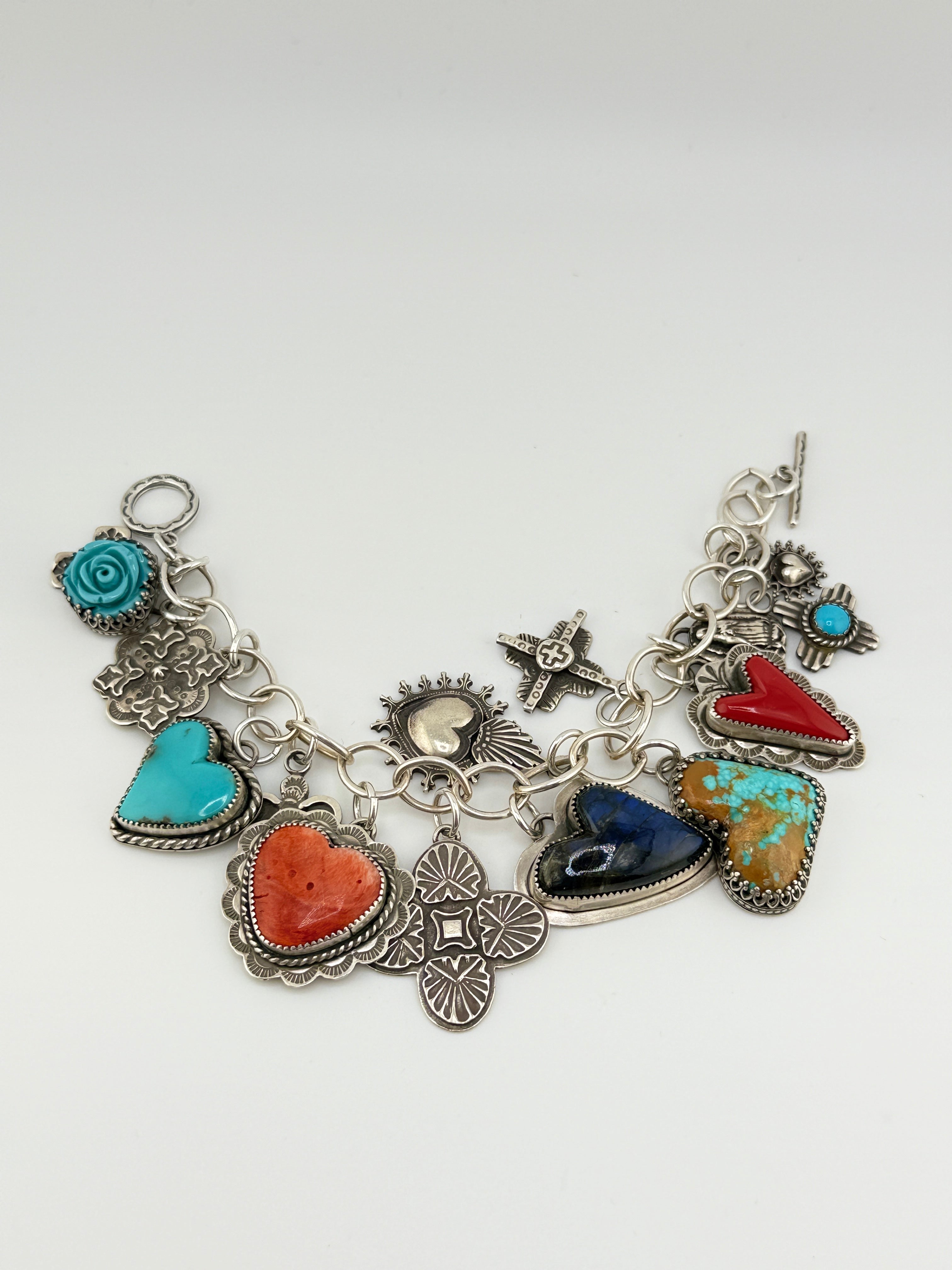 Bracelet with various charms on a white background