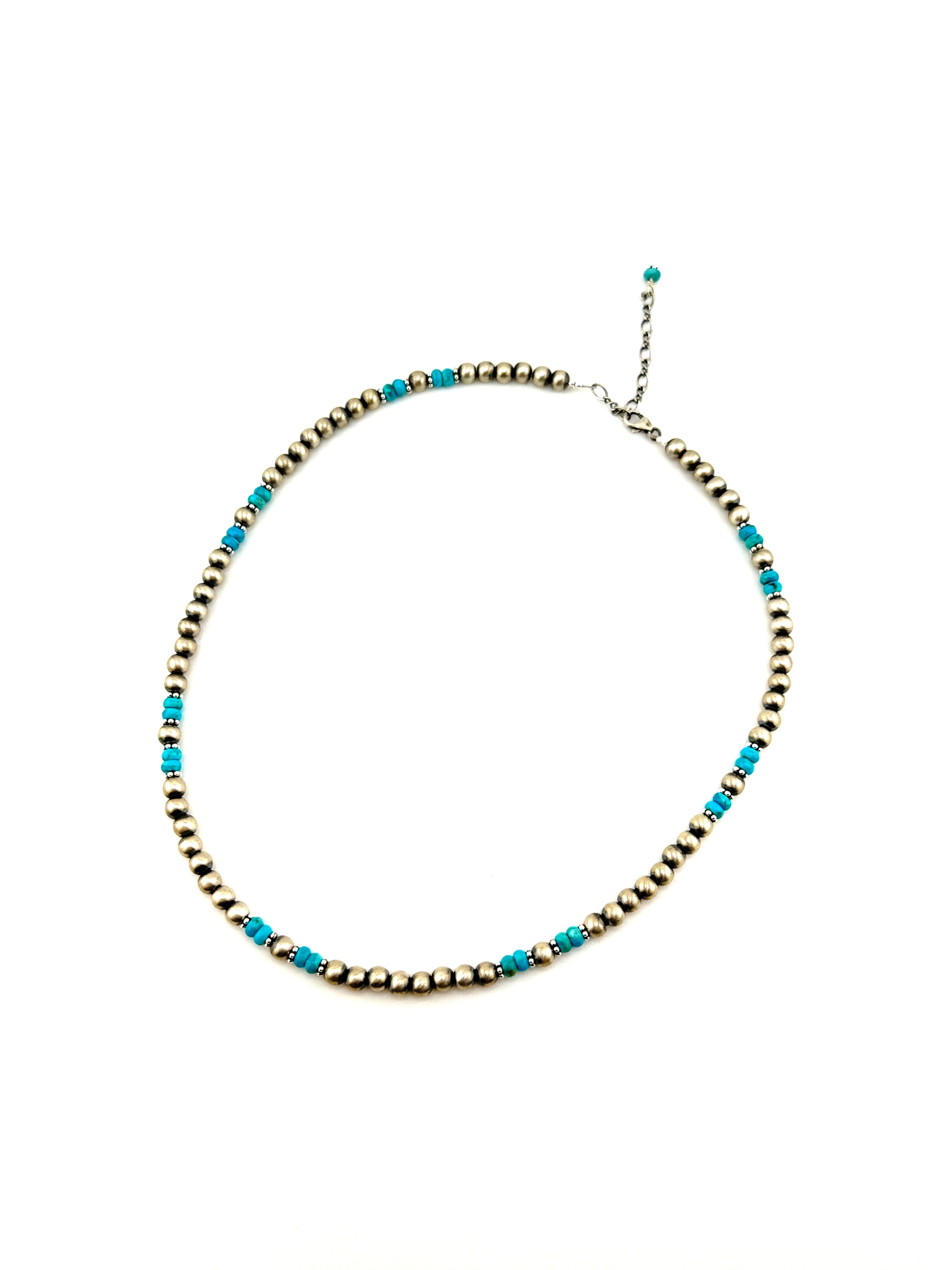 Necklace with blue and gold beads on a white background