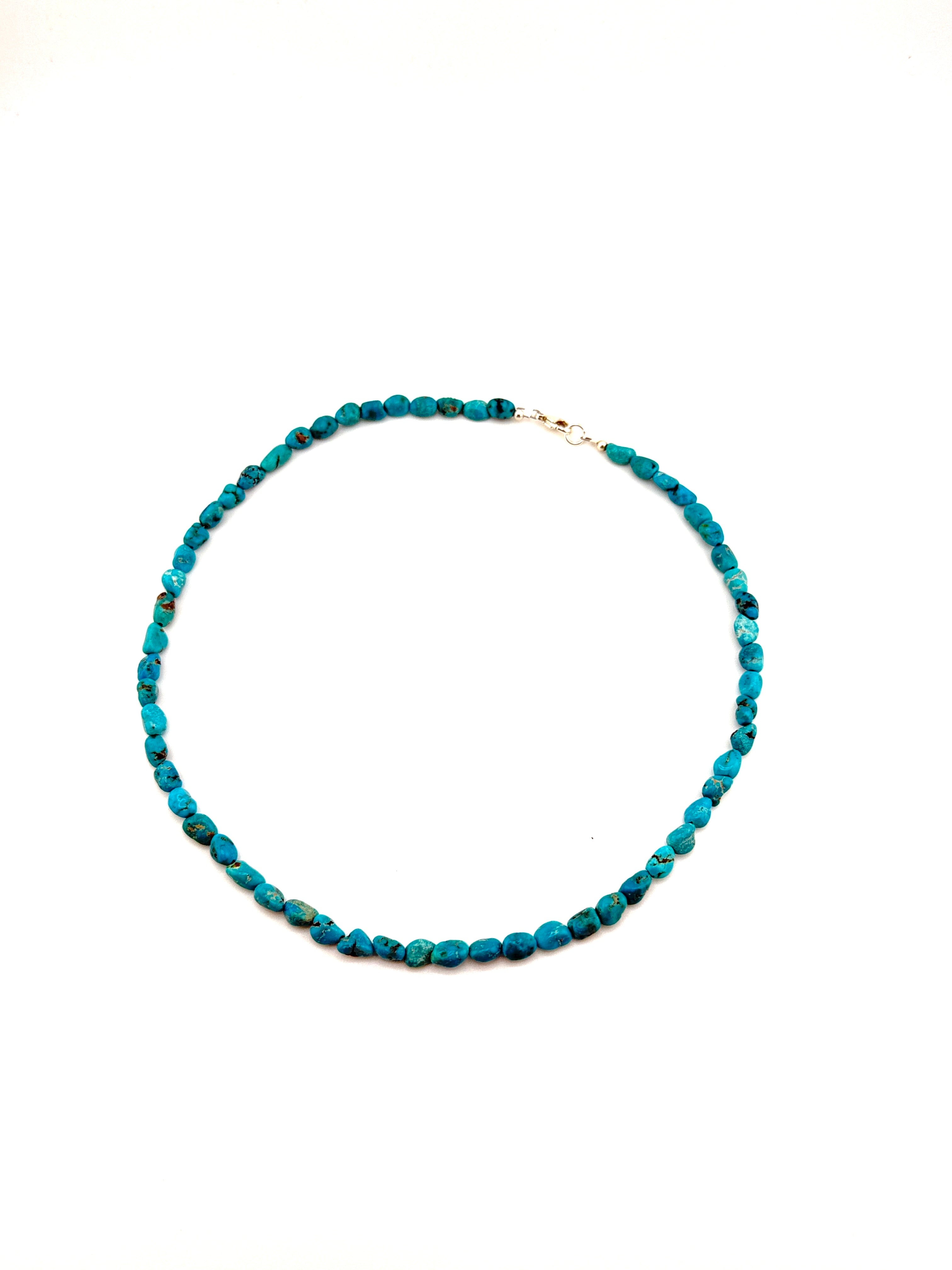 Turquoise beaded necklace on a white background