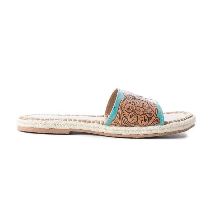 a pair of slides with tooled leather upper and turquoise accents side view