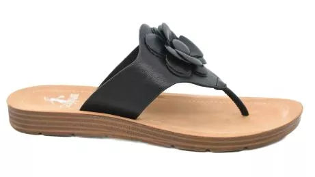 Black sandal with a flower design on a white background