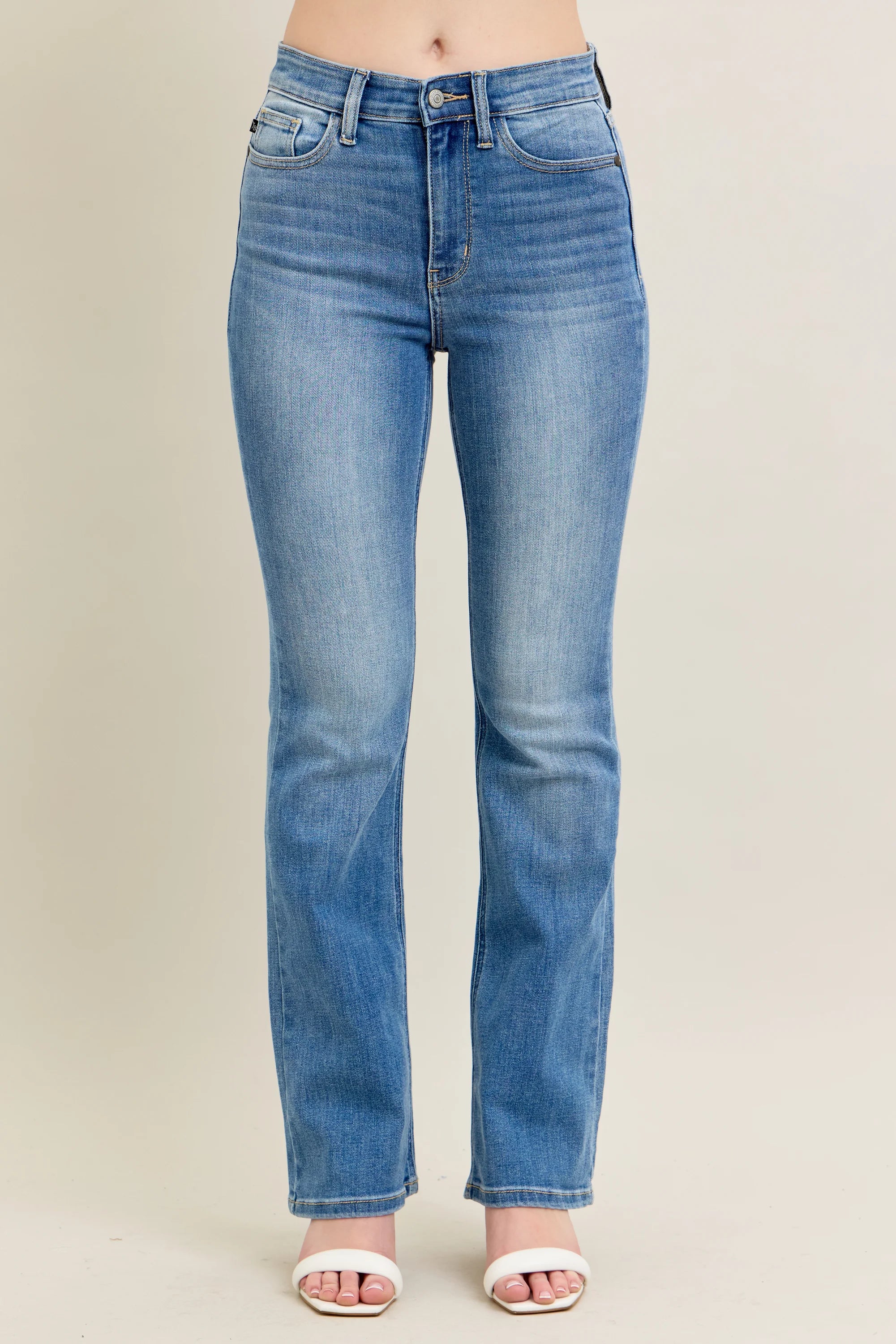 Blue jeans on a beige background