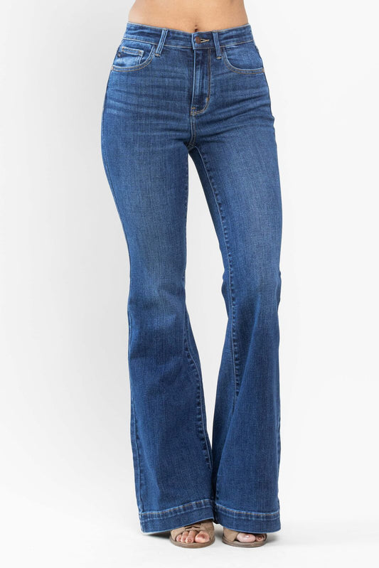 Blue flared jeans on a white background
