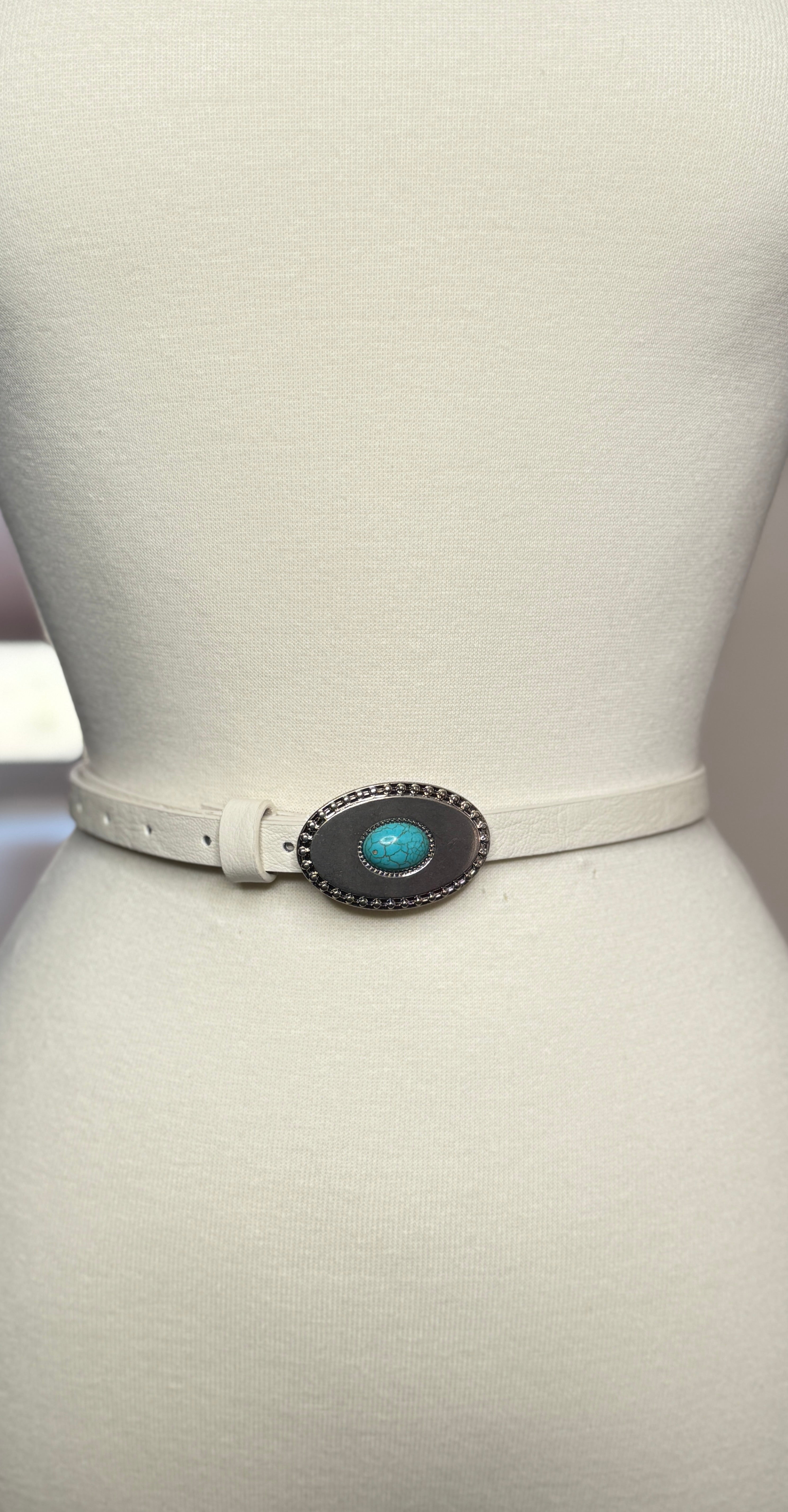 White belt with a turquoise concho on a mannequin against a white background