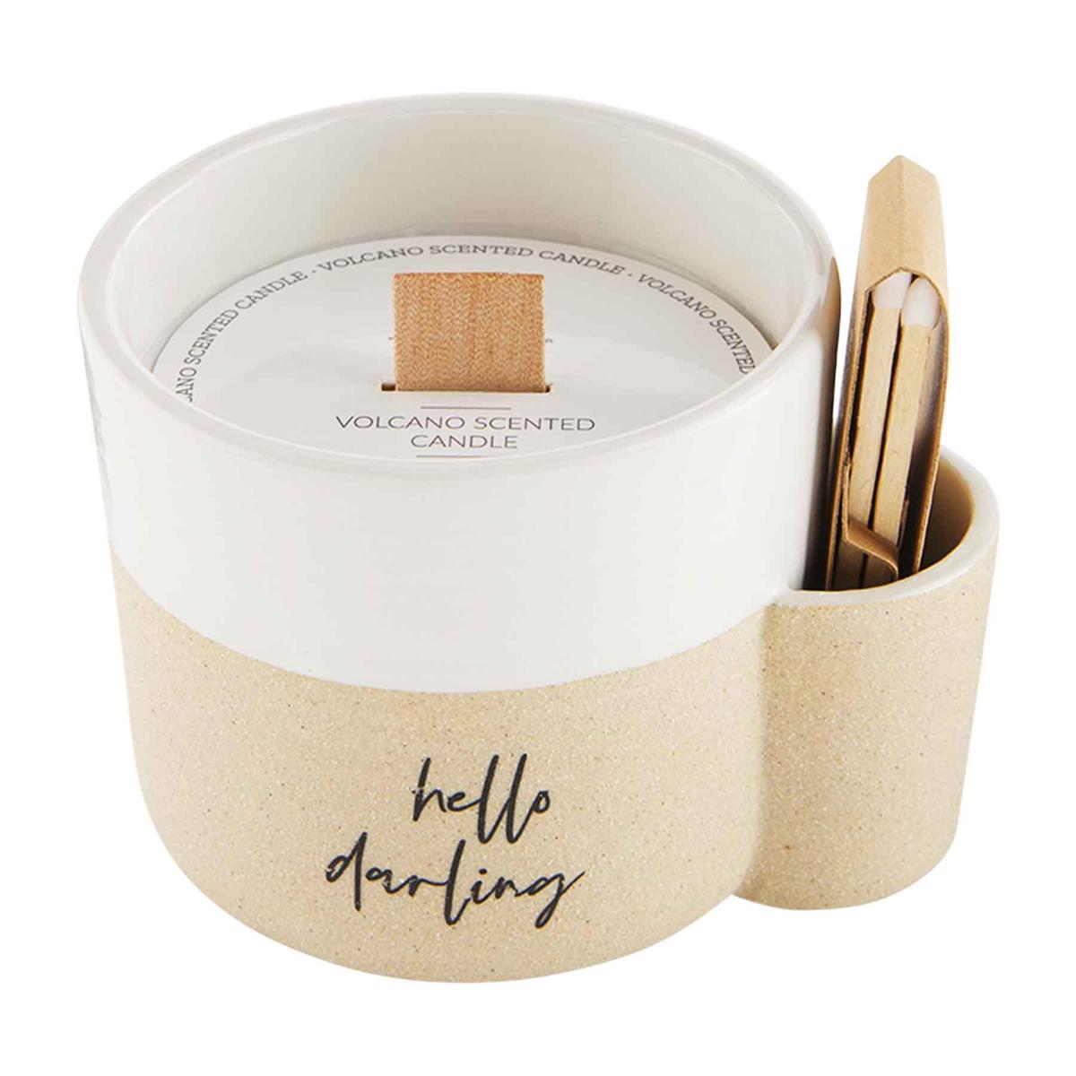 Candle in a decorative container with 'hello darling' text on a white background