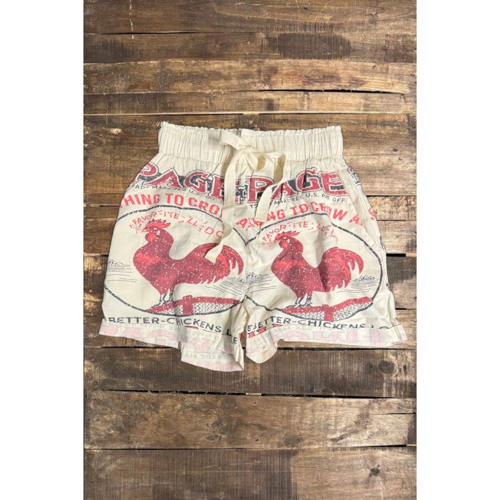 Skirt made from a repurposed flour sack with rooster design on a wooden background