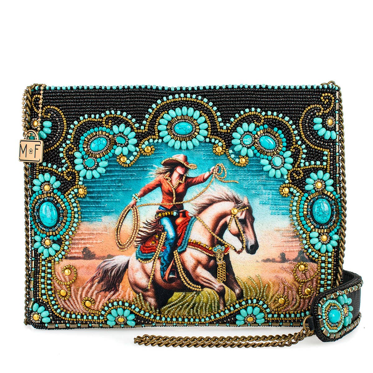 Decorative clutch with a cowboy on horseback design and turquoise embellishments.