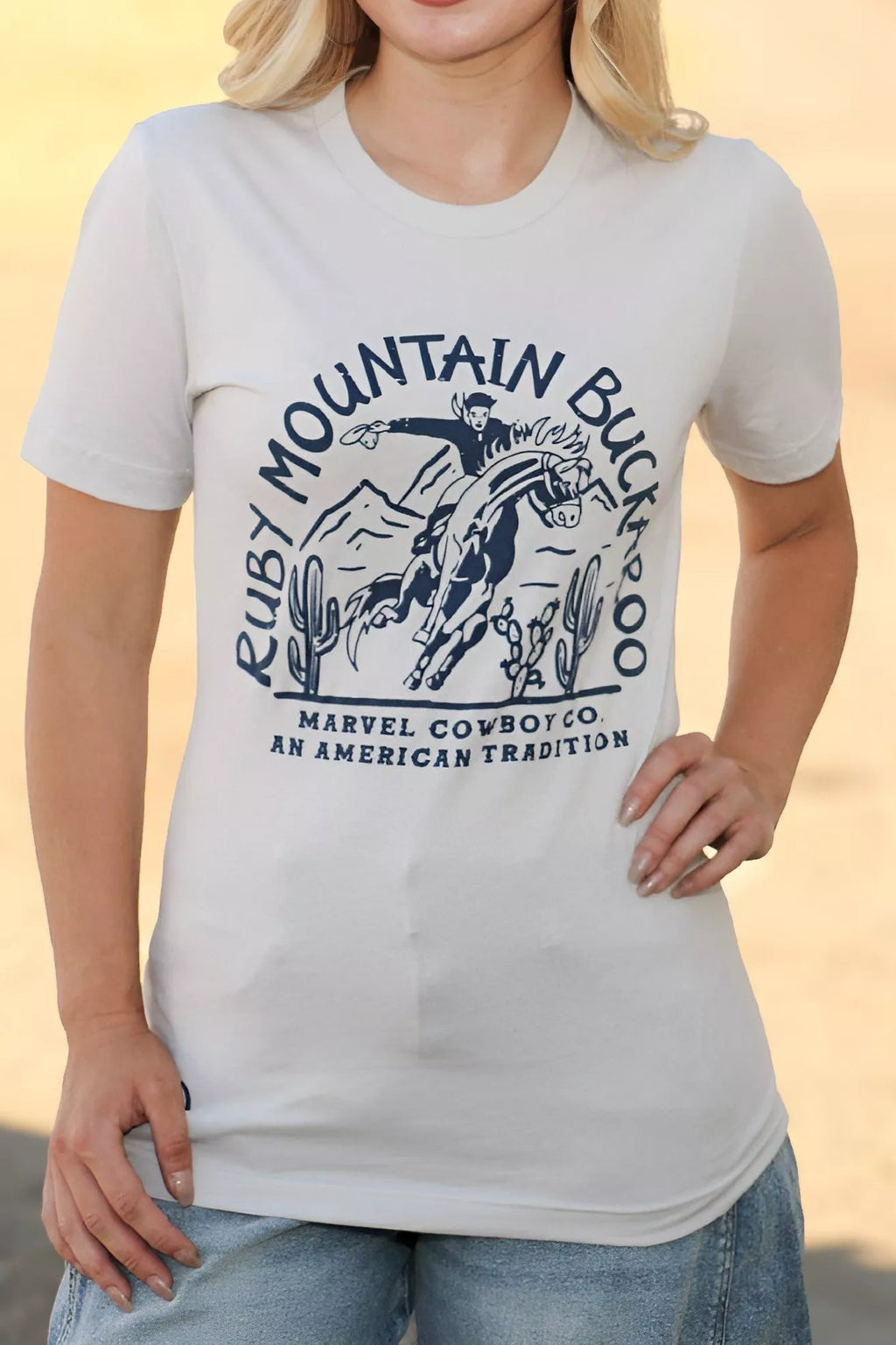 Person wearing a white t-shirt with a graphic design and text.