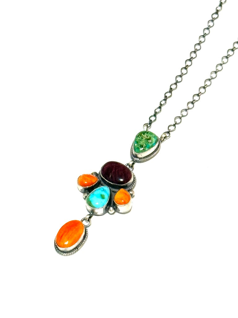 Necklace with colorful gemstones on a white background