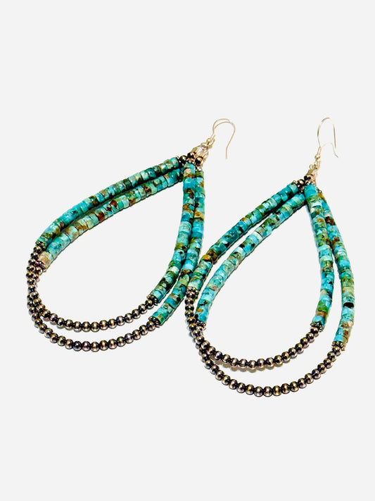 Beaded earrings with turquoise and black beads on a white background
