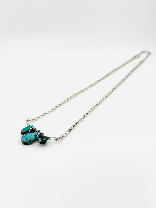 Necklace with turquoise stones on a white background