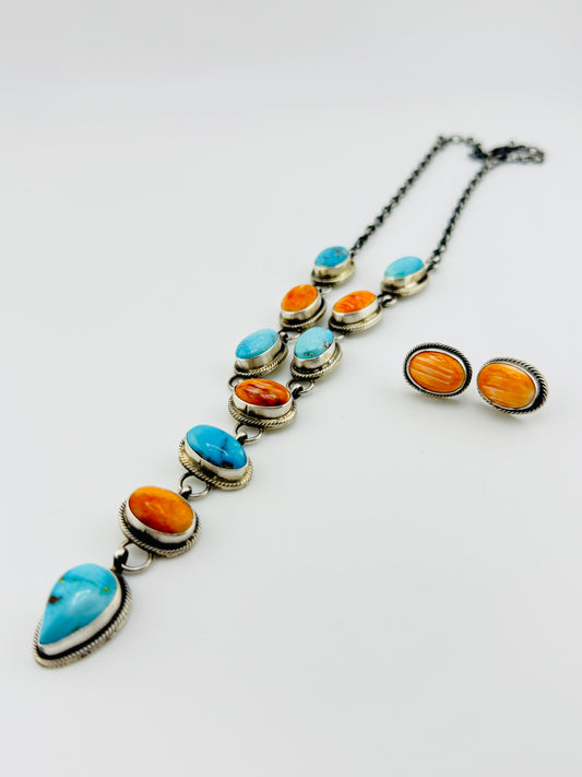 Jewelry set with necklace and earrings on a white background