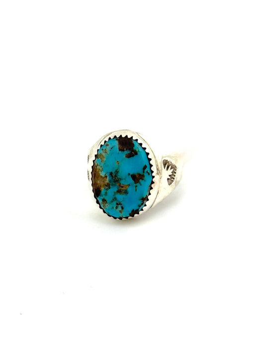 Silver earring with a turquoise stone on a white background