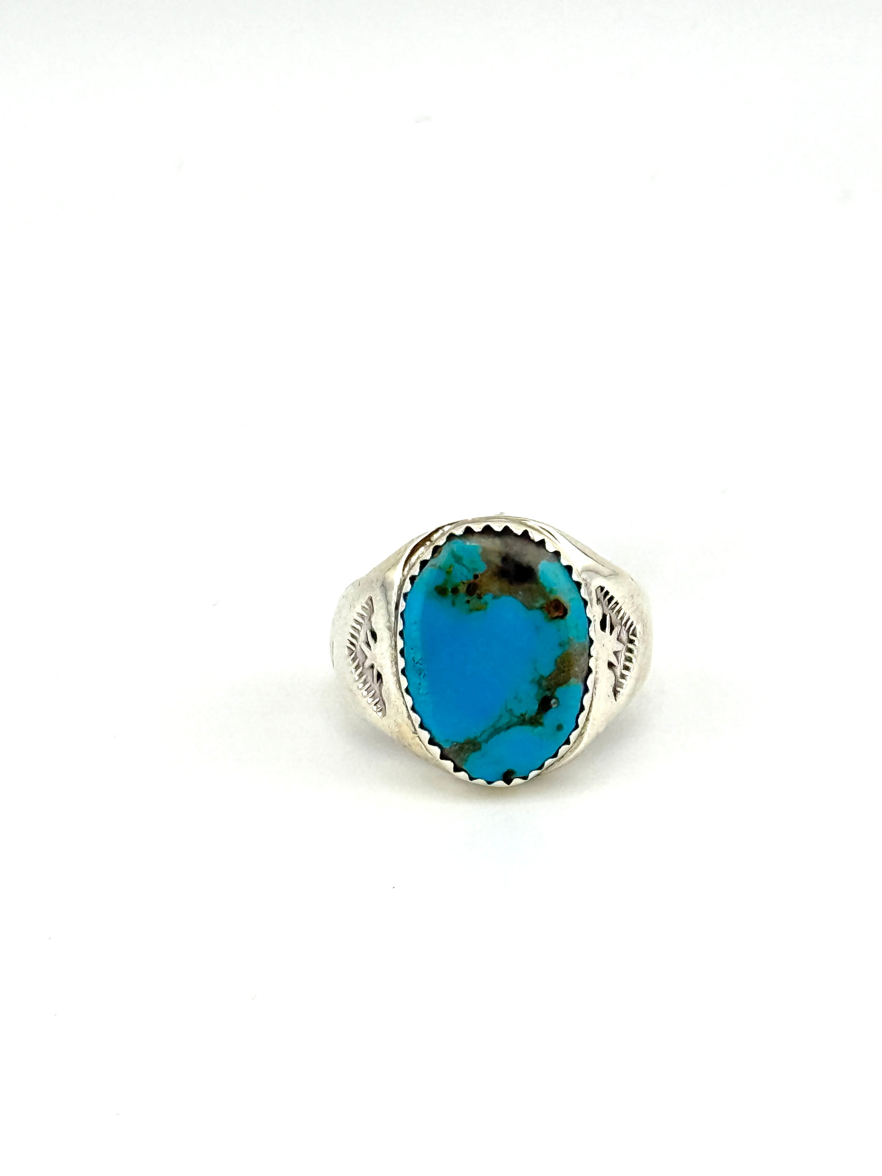 Ring with a turquoise stone on a white background