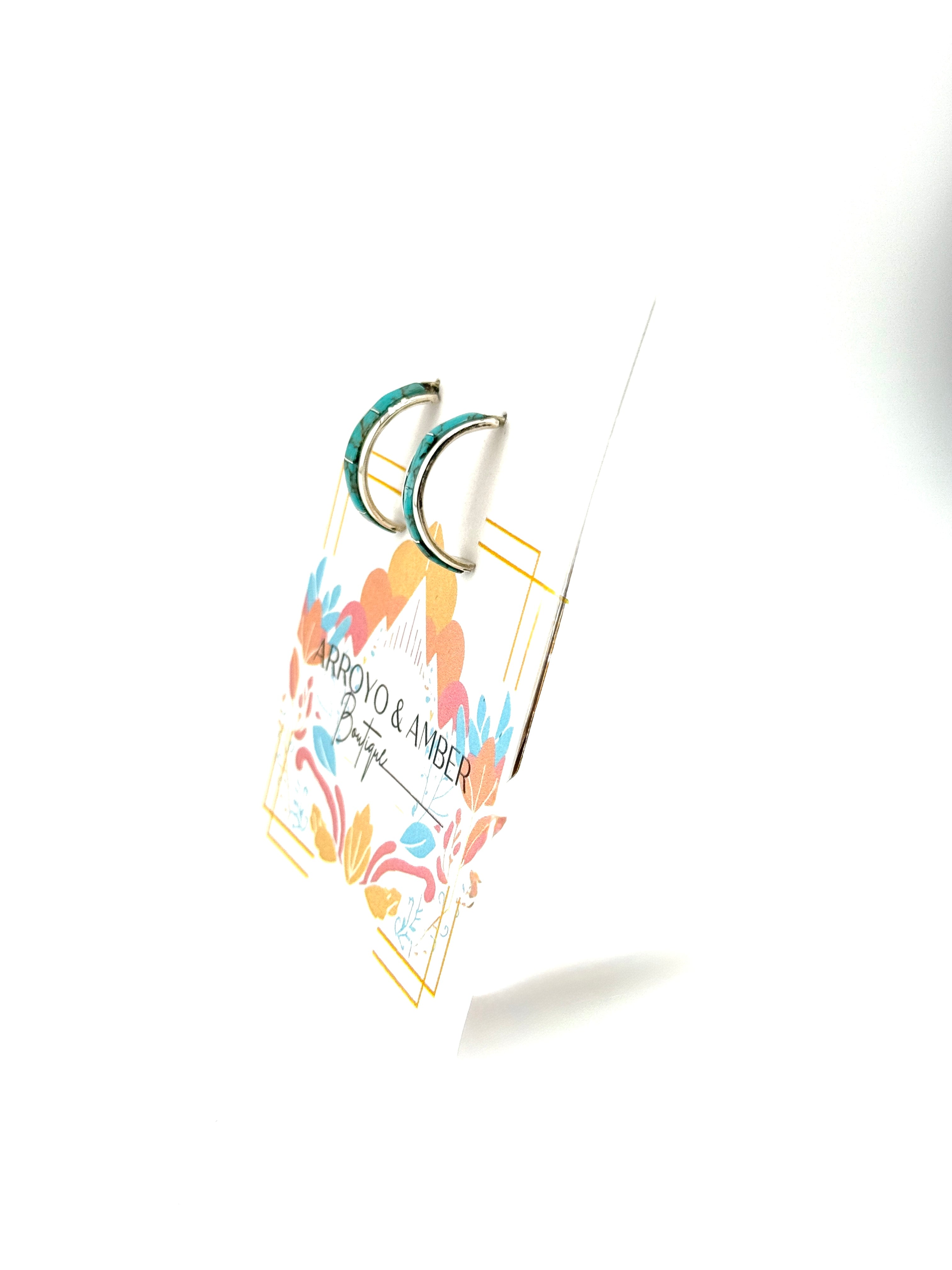 Earring card with earrings on a white background