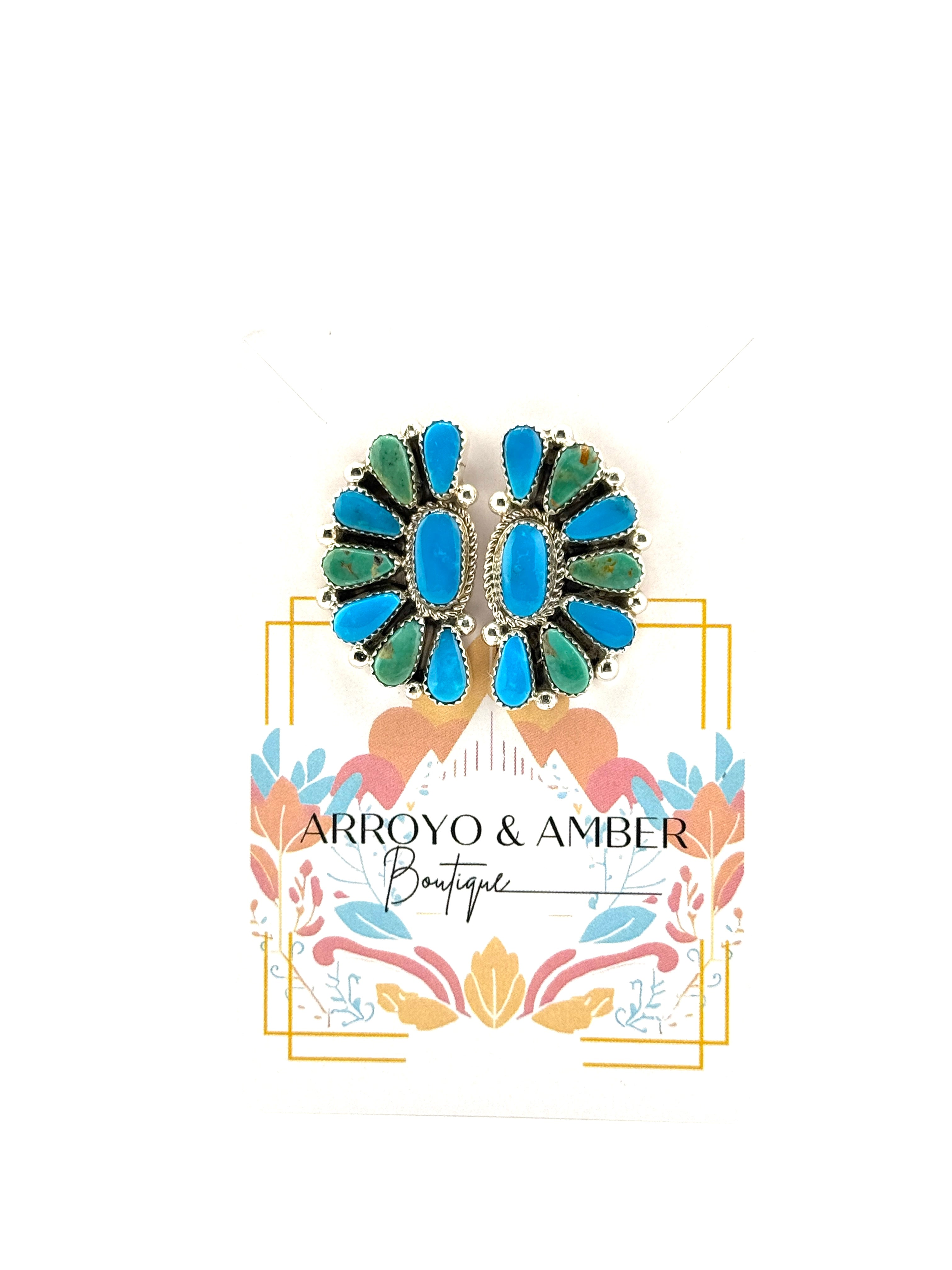 Jewelry brooch with 'Arroyo & Amber Boutique' branding on a white background