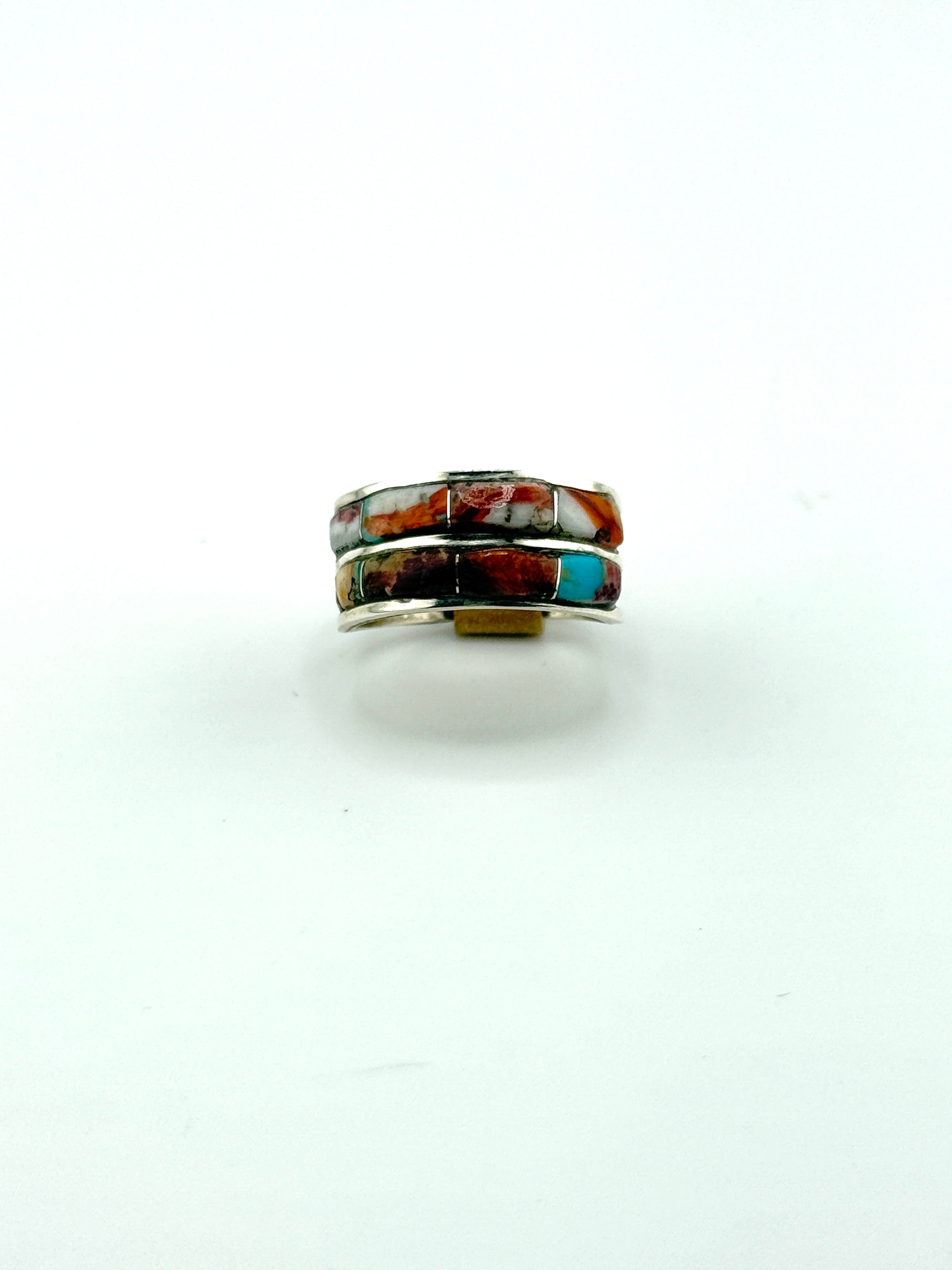 Multicolored stone ring on a white background