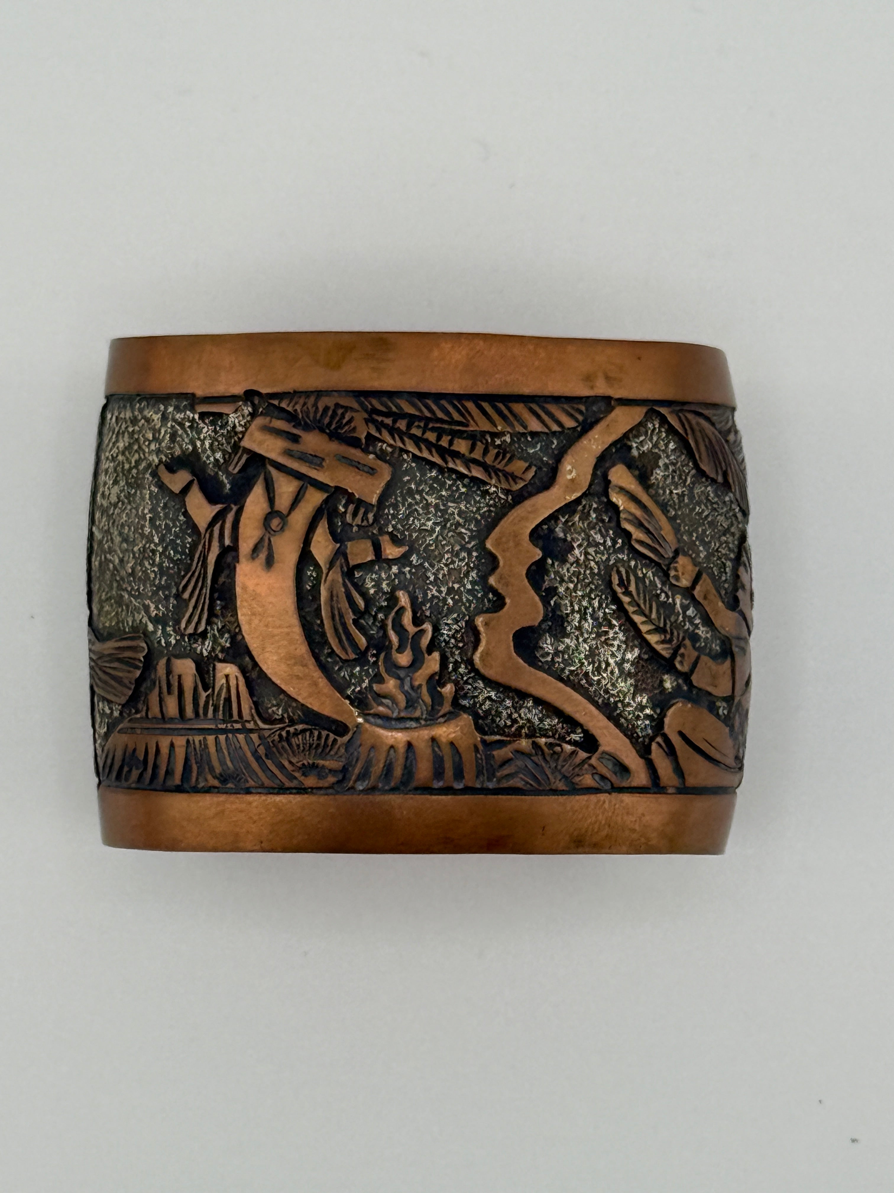 Wooden box with intricate carvings on a white background