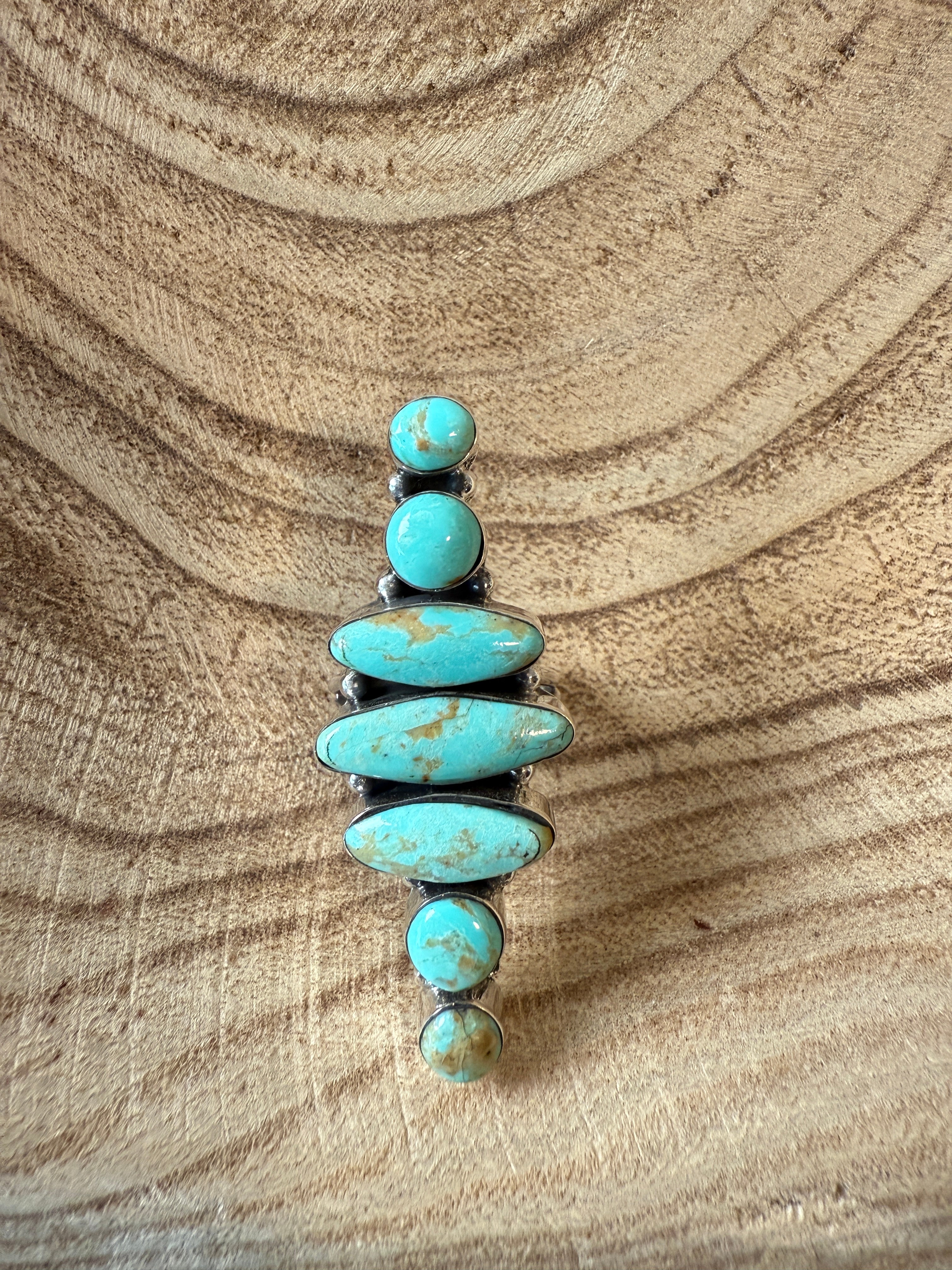 Turquoise stone bracelet on a wooden surface