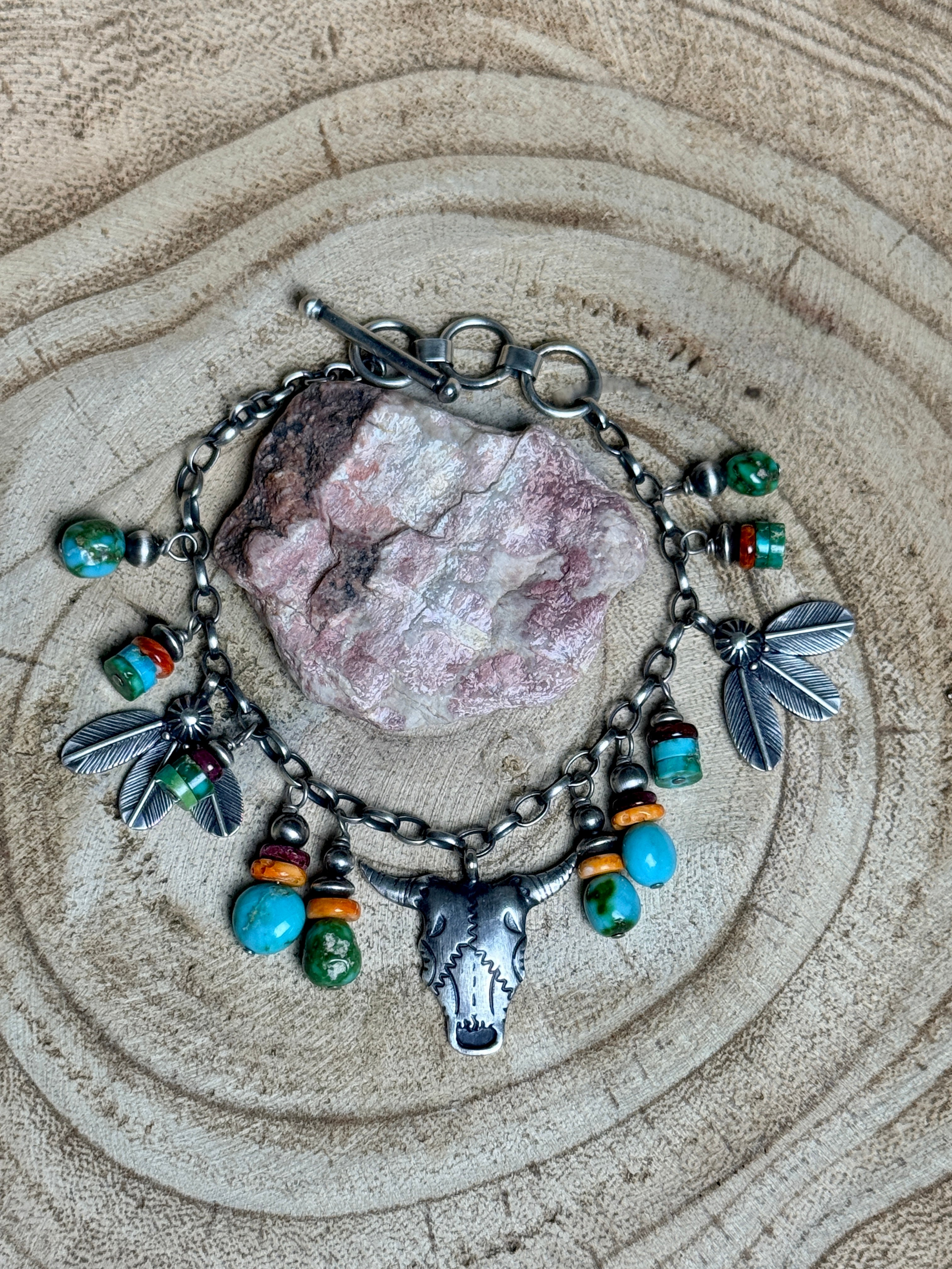 Bracelet with charms on a textured surface