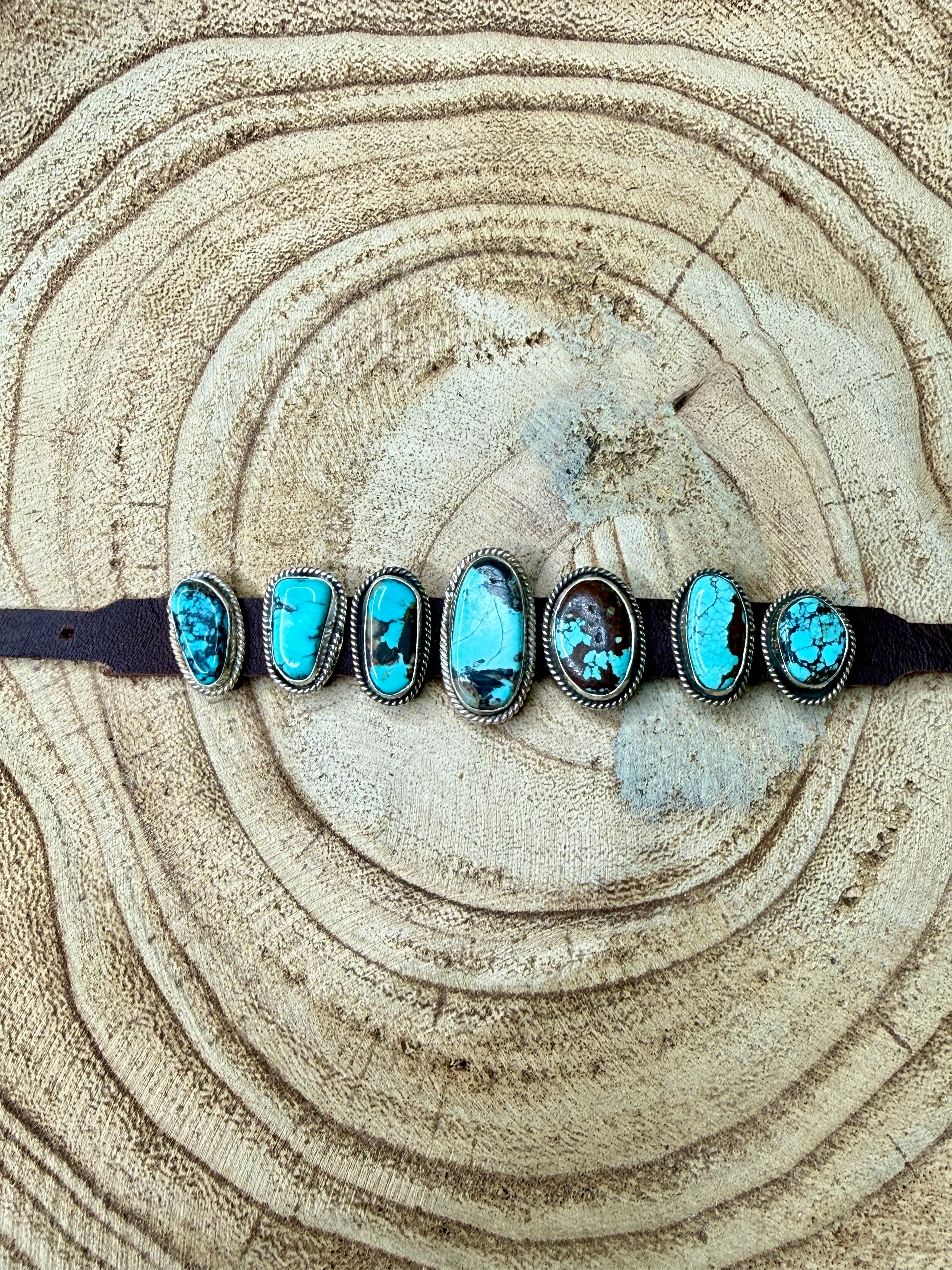 Bracelet with turquoise stones on a wooden surface