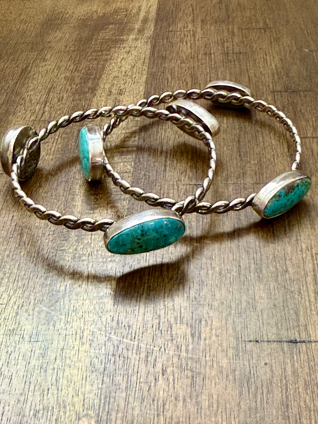 Mary and Everette Teller 3 Stone Flat Twist Bangles