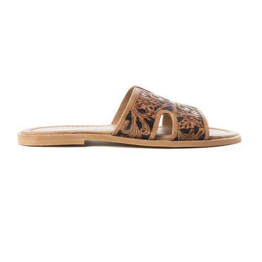 A brown leather slip-on sandal with intricate tooled floral designs and an open toe.