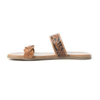 A brown leather sandal with dual straps featuring a tooled pattern and braided detailing, on a cushioned footbed.