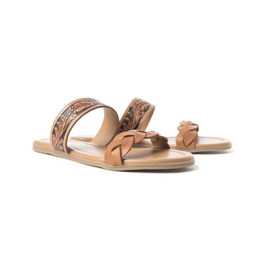 A brown leather sandal with dual straps featuring a tooled pattern and braided detailing, on a cushioned footbed.