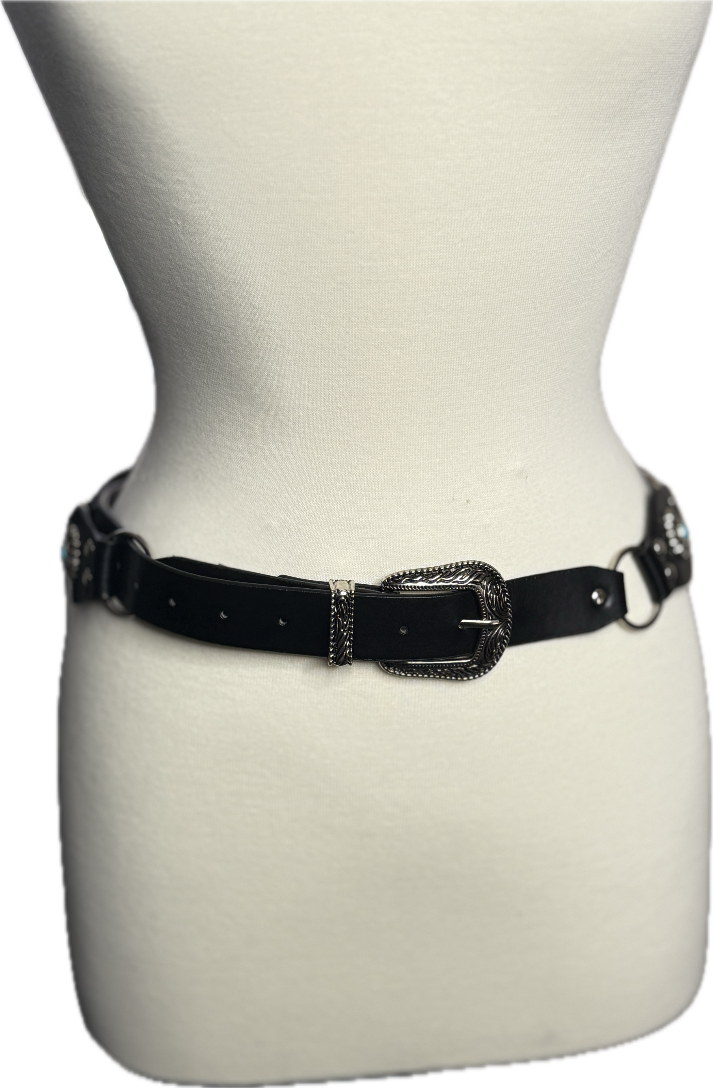 Black belt with a decorative buckle on a mannequin against a white background