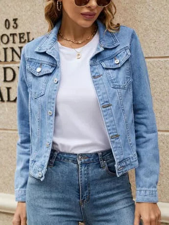 Woman in white tee wearing a denim jacket and jeans
