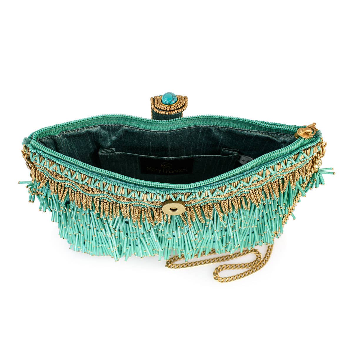Turquoise clutch with gold fringe and chain detail on a white background