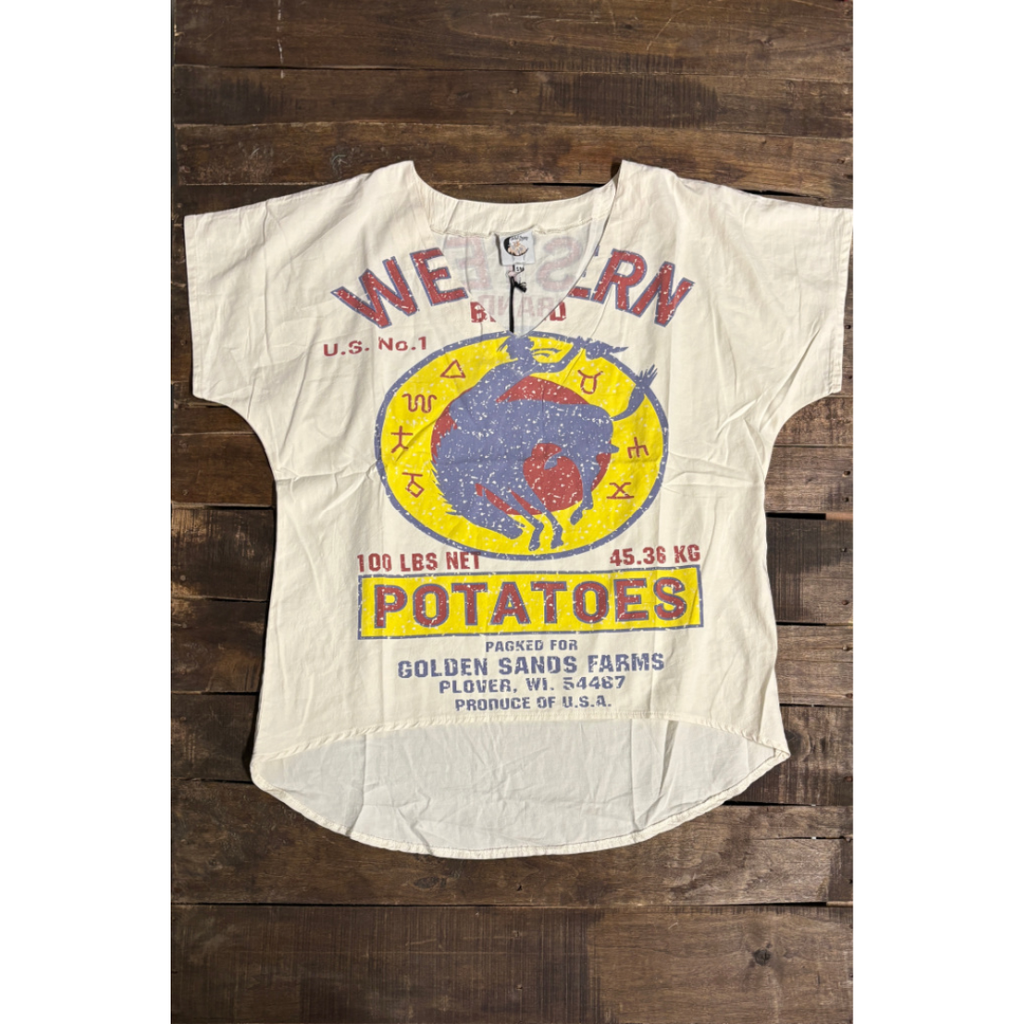 Vintage-style t-shirt with potato label design on a wooden background